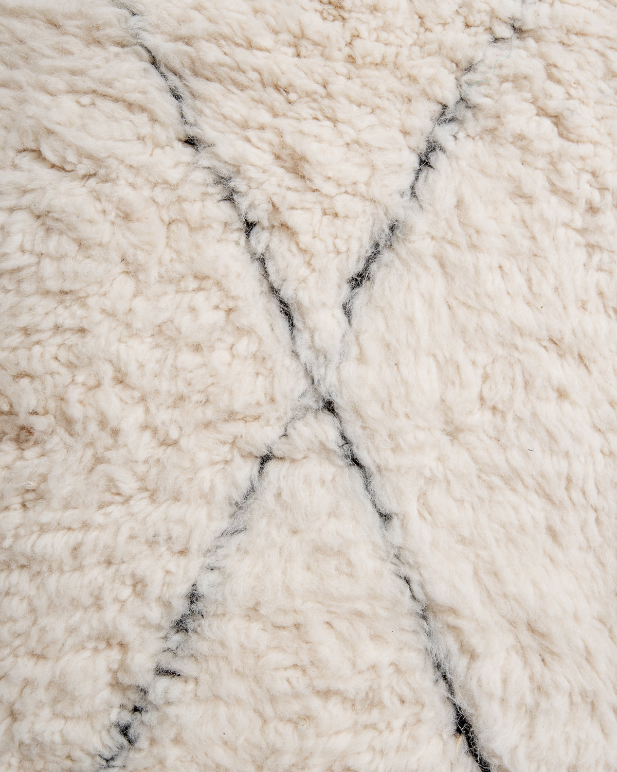 Modern, designer, handcrafted Berber rug from Morocco. Beniourain carpet with minimalist design, natural wool pile and a fluffy texture.